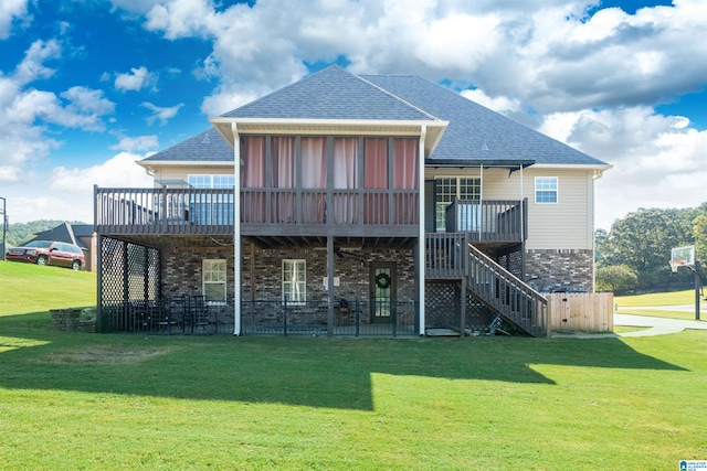 back of house with a deck and a yard