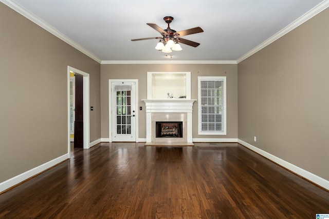 unfurnished living room with dark hardwood / wood-style flooring, ceiling fan, and crown molding