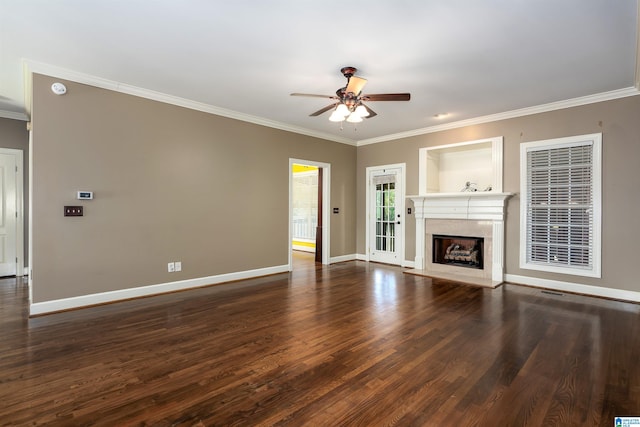 unfurnished living room with ornamental molding, dark hardwood / wood-style flooring, and ceiling fan