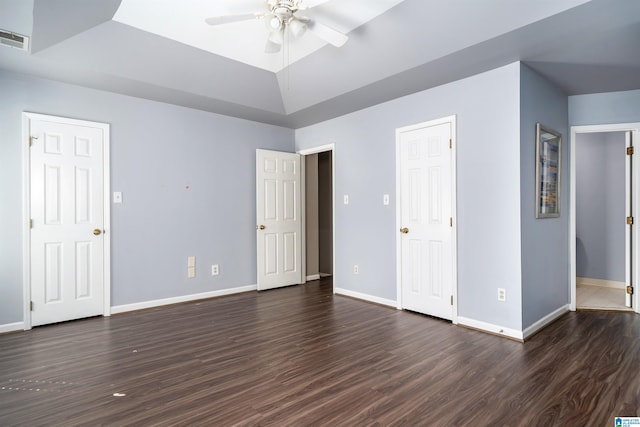 unfurnished bedroom featuring ceiling fan and dark hardwood / wood-style floors