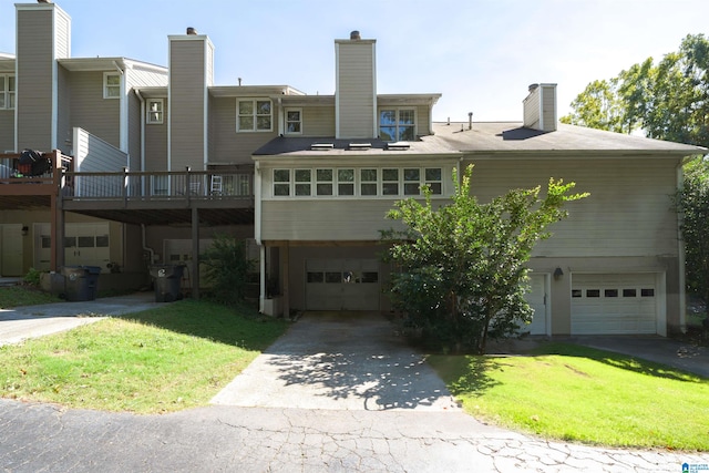 exterior space featuring a garage and a front yard