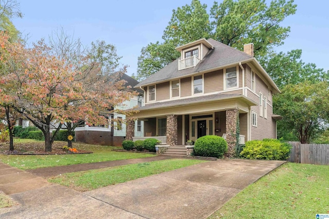 view of front of home featuring a front yard and covered porch