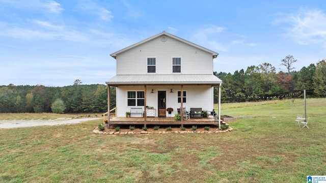 view of front of property with a porch and a front yard