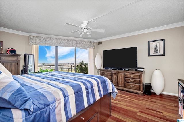 bedroom featuring hardwood / wood-style flooring, ceiling fan, a textured ceiling, and access to exterior