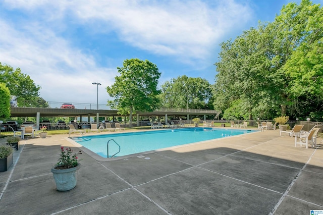 view of pool featuring a patio area