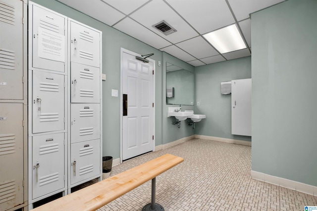 bathroom featuring a drop ceiling