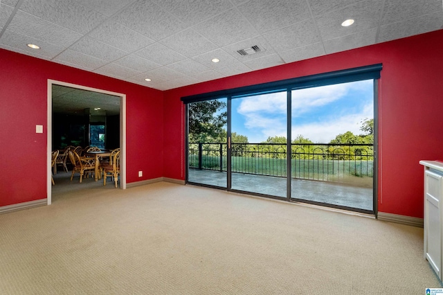 empty room with a water view and carpet floors