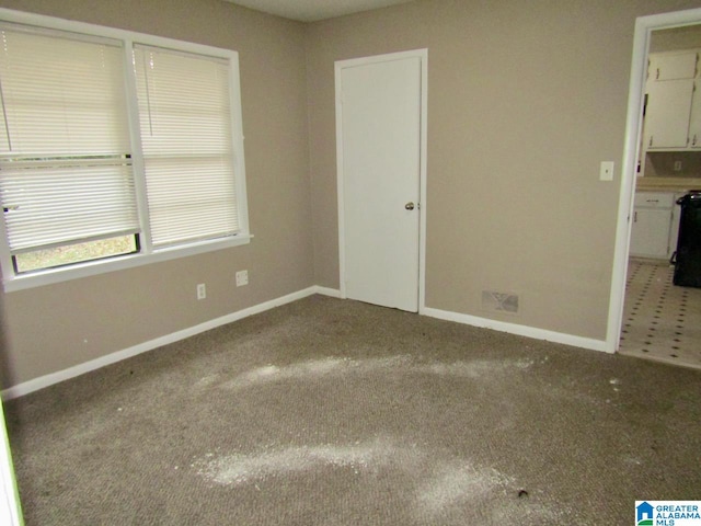 spare room with carpet floors