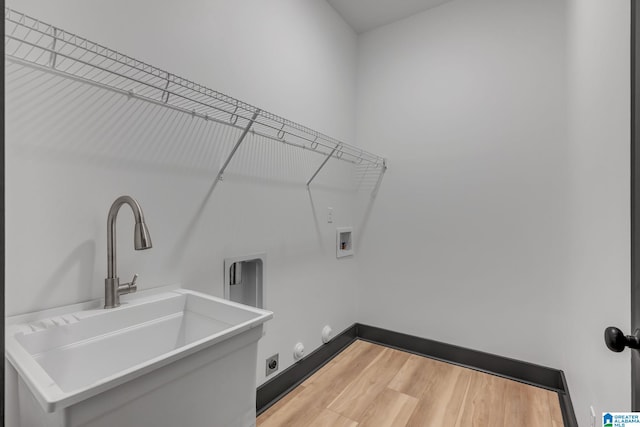 1174 Ranch Marina Rd, Pell City, AL 35128 - clothes washing area with hookup for a washing machine, light wood-style flooring, and gas dryer hookup