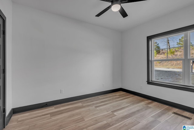 1174 Ranch Marina Rd, Pell City, AL 35128 - spare room with light wood-style floors, a ceiling fan, and baseboards