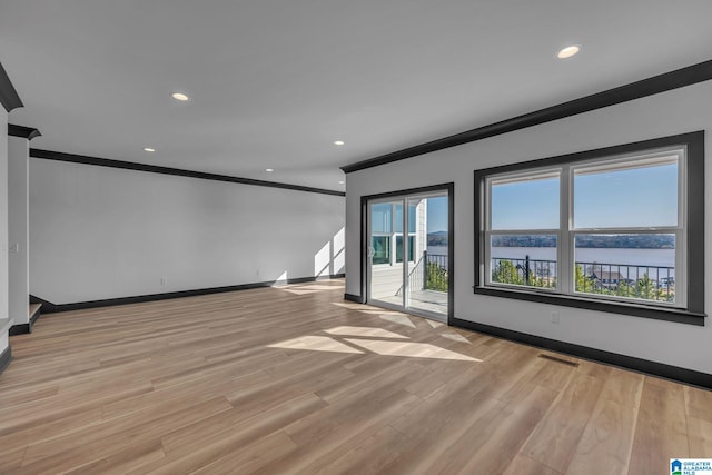 1174 Ranch Marina Rd, Pell City, AL 35128 - unfurnished room with ornamental molding, baseboards, light wood finished floors, and recessed lighting
