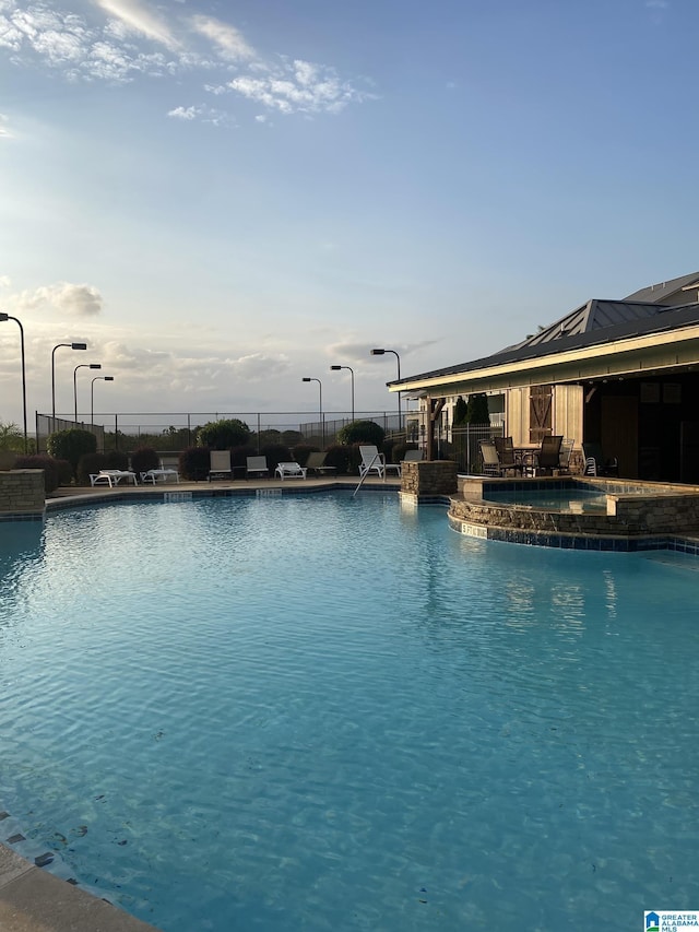 1174 Ranch Marina Rd, Pell City, AL 35128 - community pool with fence and a jacuzzi