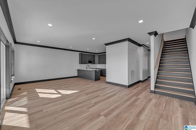 1174 Ranch Marina Rd, Pell City, AL 35128 - unfurnished living room featuring baseboards, ornamental molding, light wood finished floors, recessed lighting, and stairs