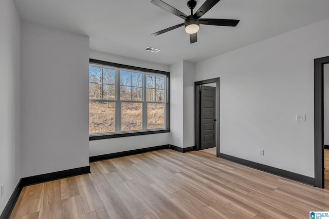 1174 Ranch Marina Rd, Pell City, AL 35128 - spare room featuring light wood-type flooring, baseboards, and a ceiling fan