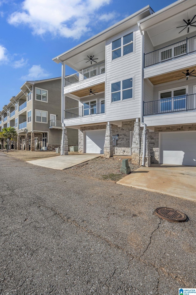 1174 Ranch Marina Rd, Pell City, AL 35128 - view of apartment building / complex with an attached garage and central AC unit
