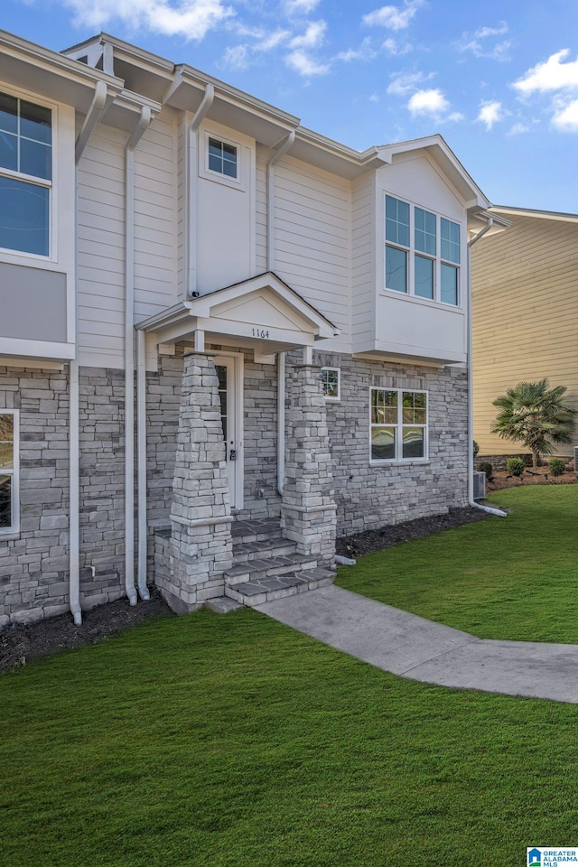 1174 Ranch Marina Rd, Pell City, AL 35128 - townhome / multi-family property with stone siding and a front lawn