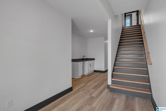 1174 Ranch Marina Rd, Pell City, AL 35128 - stairway featuring wood finished floors, baseboards, recessed lighting, and wet bar