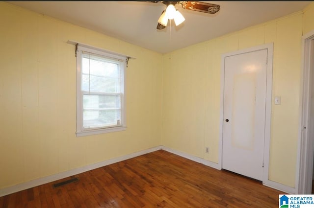 unfurnished bedroom with hardwood / wood-style floors and ceiling fan