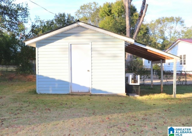 view of outdoor structure featuring a yard