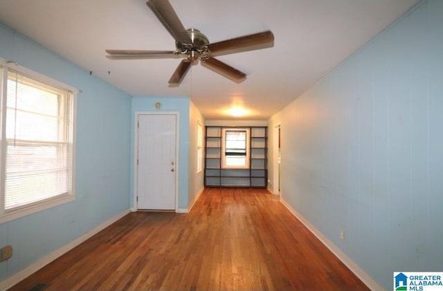 interior space with hardwood / wood-style flooring and ceiling fan