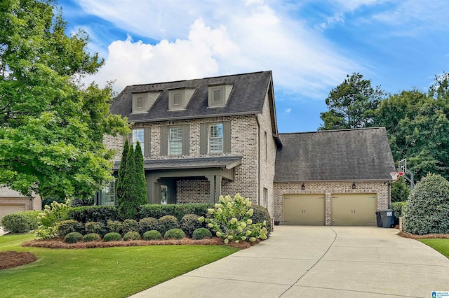 view of front of house featuring a garage and a front yard