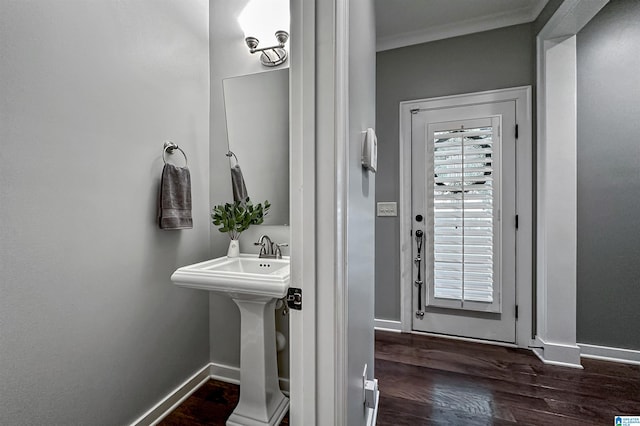 bathroom featuring hardwood / wood-style floors and crown molding