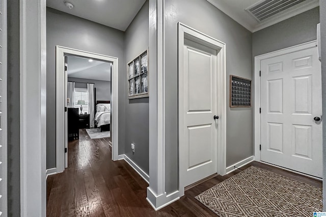 hall with dark hardwood / wood-style flooring