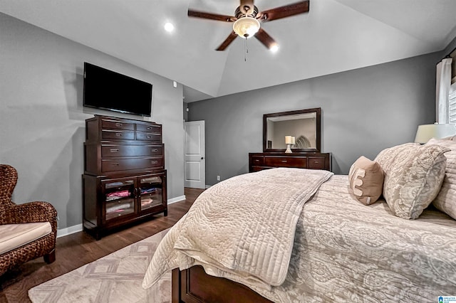 bedroom featuring dark wood-type flooring, ceiling fan, and vaulted ceiling