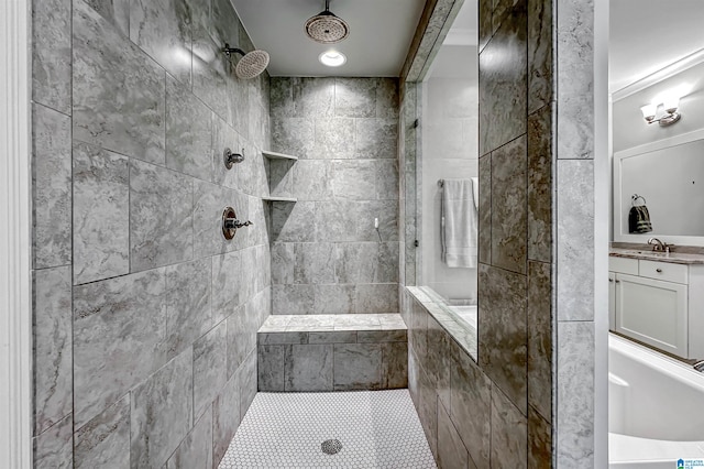 bathroom with crown molding and a tile shower