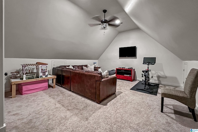 living room with vaulted ceiling, light colored carpet, and ceiling fan