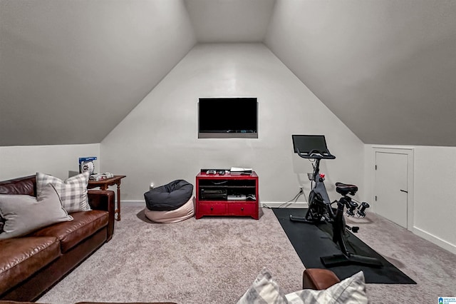 exercise area featuring carpet flooring and vaulted ceiling