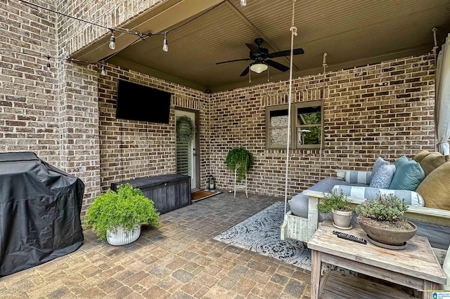 view of patio with an outdoor hangout area, area for grilling, and ceiling fan