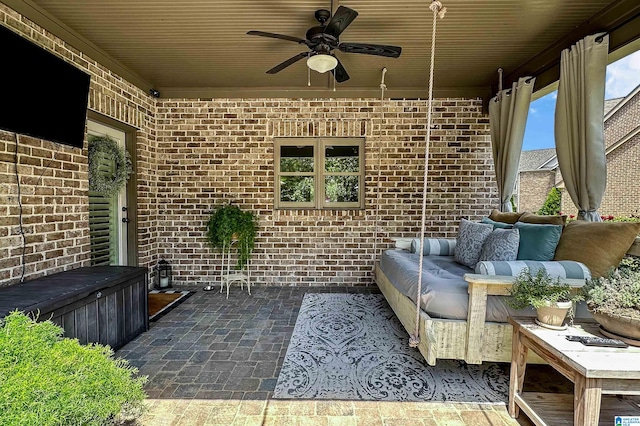 view of patio featuring ceiling fan and an outdoor living space