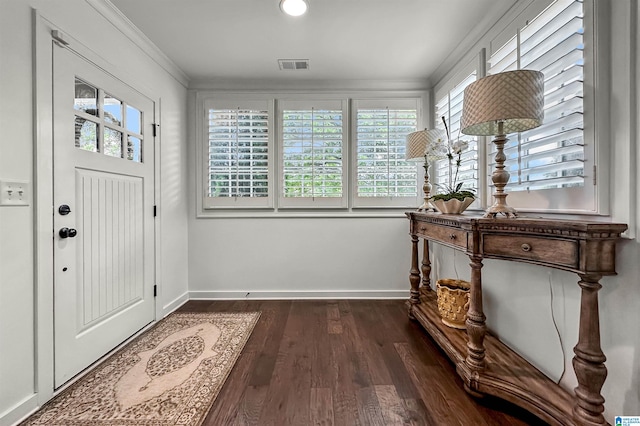 entryway featuring dark wood-type flooring, a wealth of natural light, and crown molding