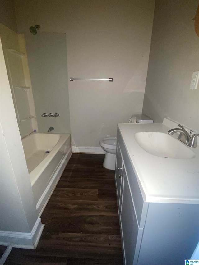 full bathroom with toilet, shower / tub combination, vanity, and hardwood / wood-style floors