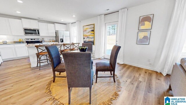 dining space featuring light hardwood / wood-style flooring