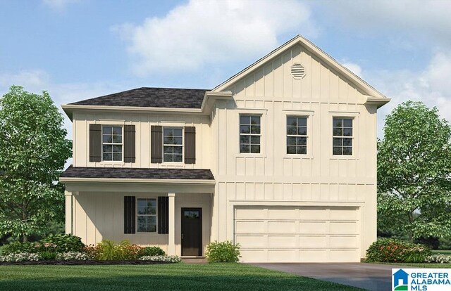 view of front facade with a garage and a front yard