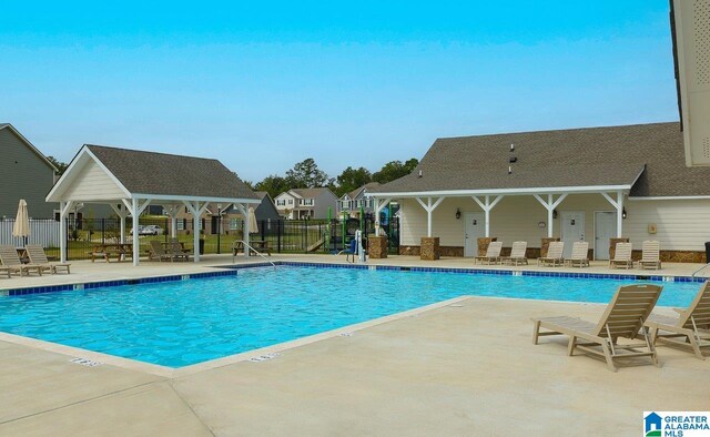 view of pool with a patio and a gazebo