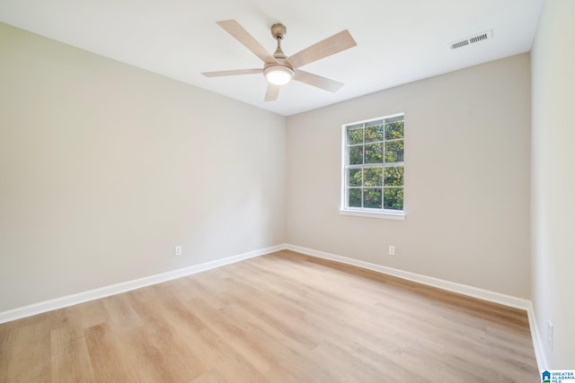 spare room featuring ceiling fan and light hardwood / wood-style flooring