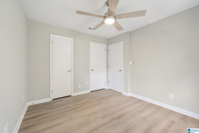 unfurnished bedroom with light hardwood / wood-style floors and ceiling fan