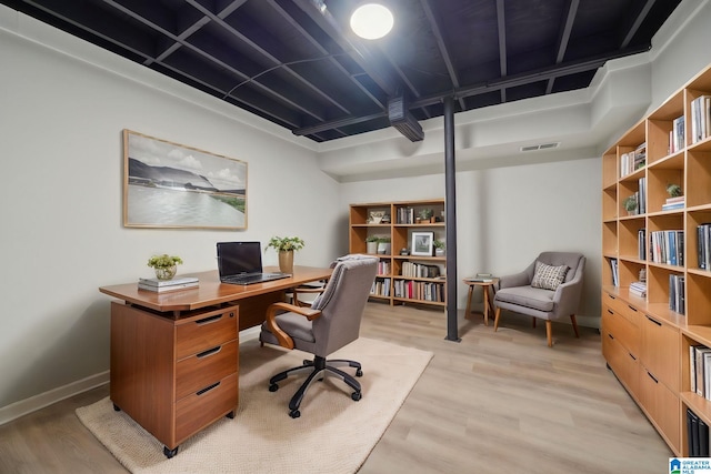 office space with light wood-type flooring