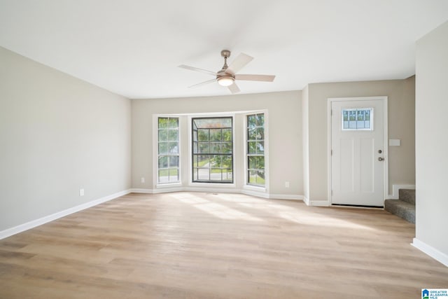 foyer entrance featuring light hardwood / wood-style flooring and ceiling fan