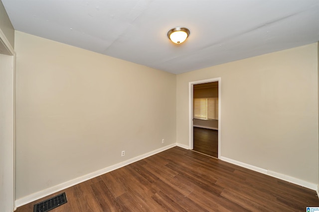 empty room featuring dark hardwood / wood-style floors