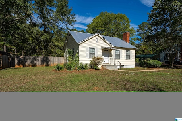 bungalow-style home with a front yard