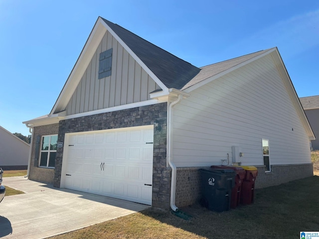 view of side of property with a garage