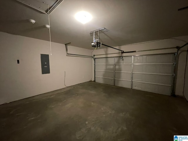 garage featuring electric panel and a garage door opener