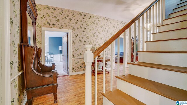 staircase featuring hardwood / wood-style floors