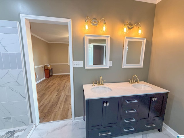 bathroom featuring a shower, vanity, and ornamental molding