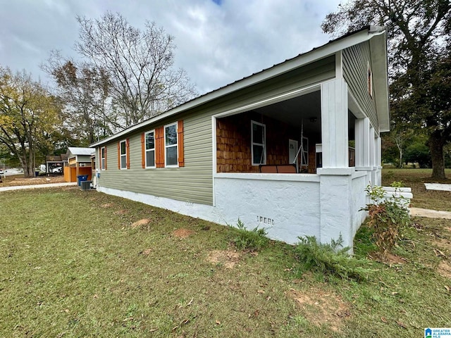 view of home's exterior featuring a lawn