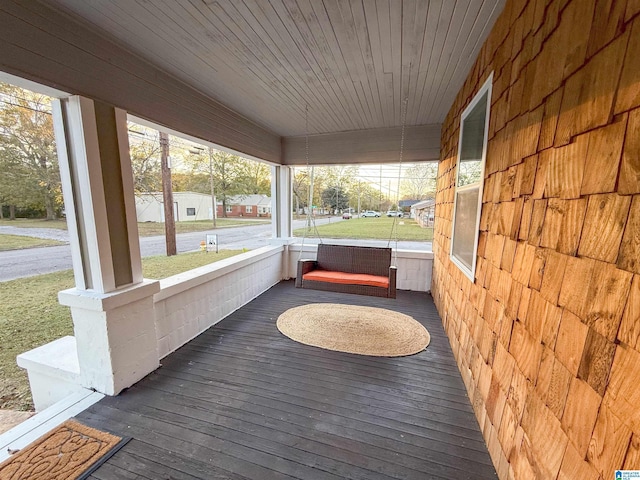 wooden terrace featuring a porch